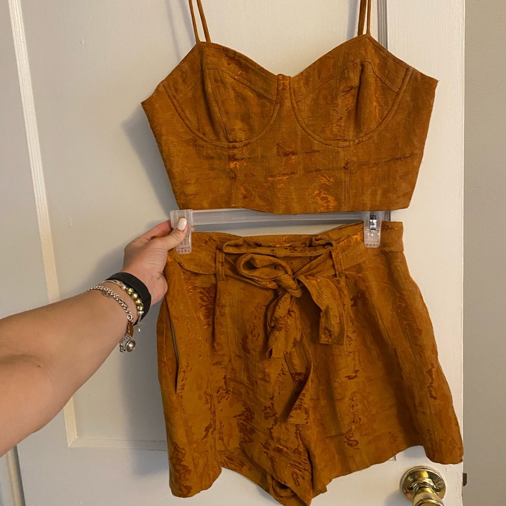Deep orange set. Crop top with zipper and high waisted shorts with bow tie belt